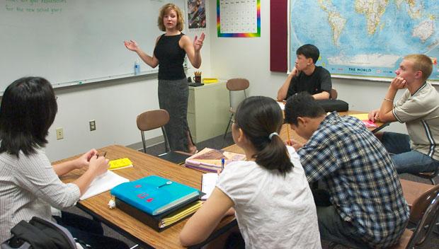 An English language learner teacher interacts with her students