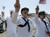 Soldiers in uniform march during a gay pride parade