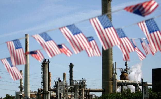 American flags near an oil refinery in California