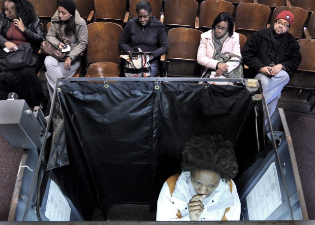 African American woman in the voting booth