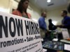 Now Hiring sign at a jobs fair