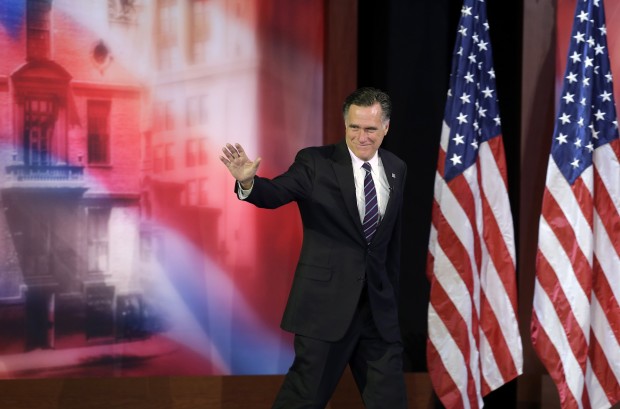 Former Massachusetts Gov. Mitt Romney waves to supporters before conceding the 2012 presidential race.