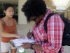 Aubrey Marks, left, helps a University of Central Florida student to register to vote in Orlando, Florida.
