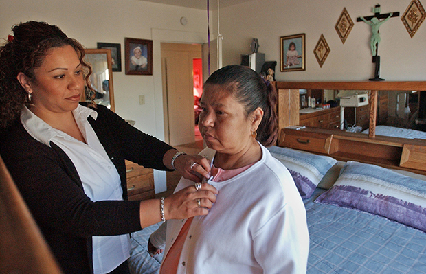 Daughter assisting mother