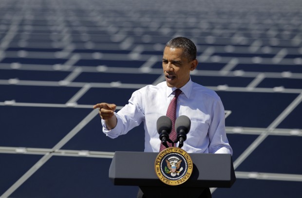 President Obama speaks in front of solar panels