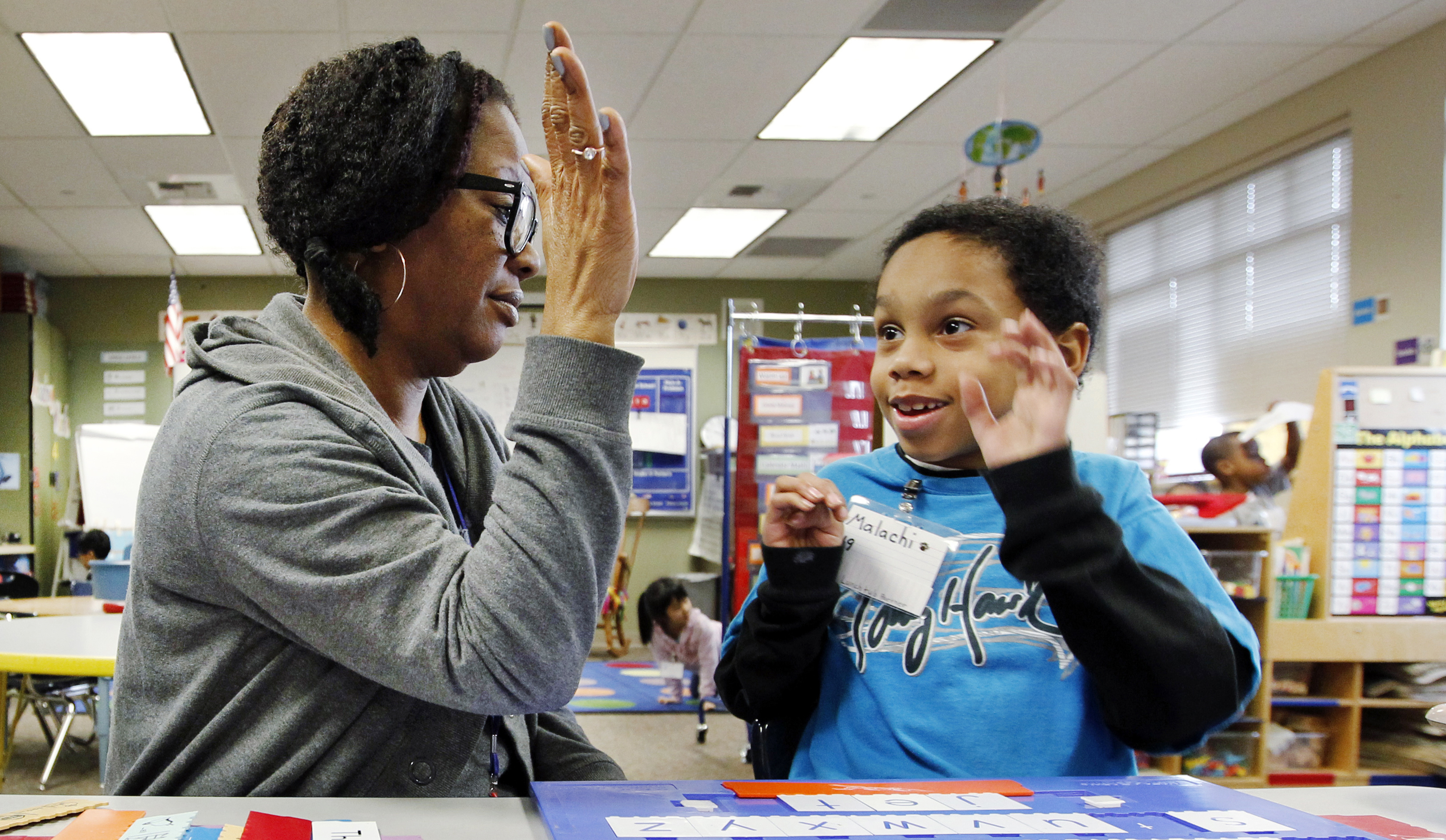 Teacher and student high five