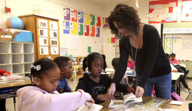 Teacher helps student