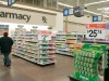 A shopper walks toward the pharmacy at a Little Rock, Arkansas, Wal-Mart store.