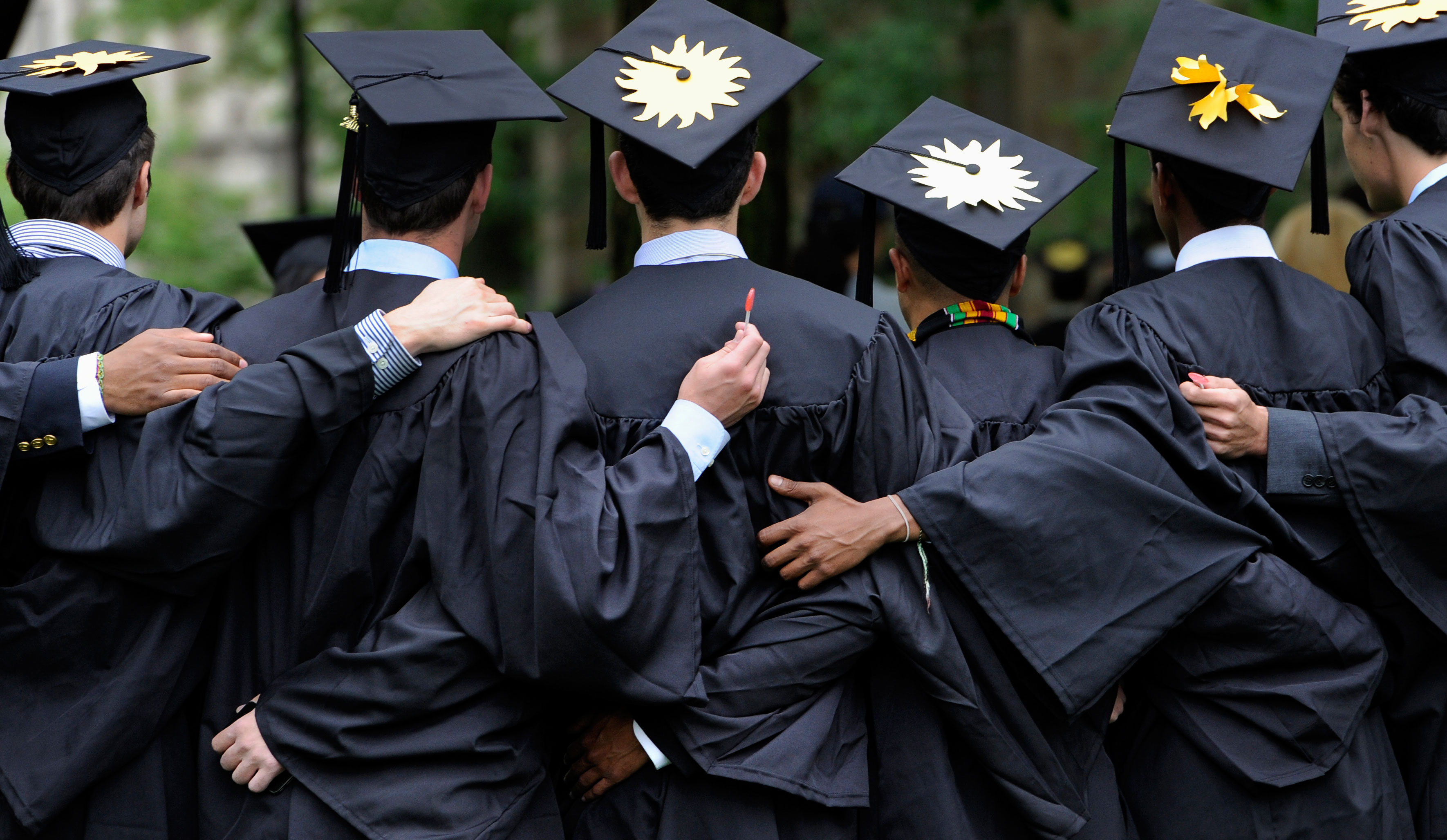 Graduates pose for photographs