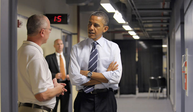 President Barack Obama talks with electrical apprenticeship instructor Tim Wisyanski