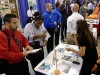 Job seekers attend a job fair.