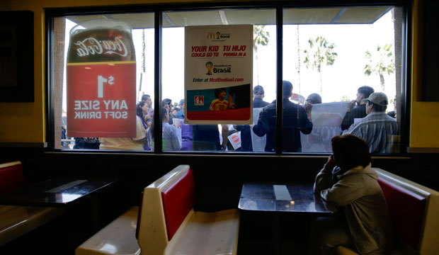 Demonstrators protest outside a McDonald's restaurant