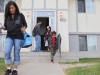 A woman leaves her house