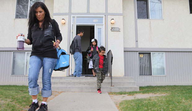 A woman leaves her house