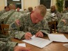 Soldier fills out paperwork