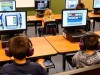 Students work on computers.