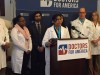 Doctors for America presents a petition at a press conference.