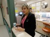 A nurse prepares to hand out medicine
