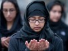 Shiite Muslims pray together and rally