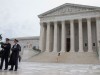 Police stand outside the U.S. Supreme Court.