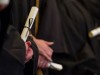 Graduate holds diploma