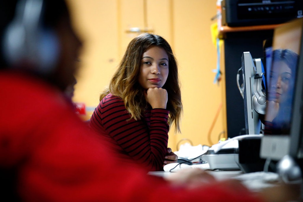 Andrea Aguilera, who has been able to get a work permit and avoid deportation through DACA, sits at a computer in Chicago on November 17, 2016.