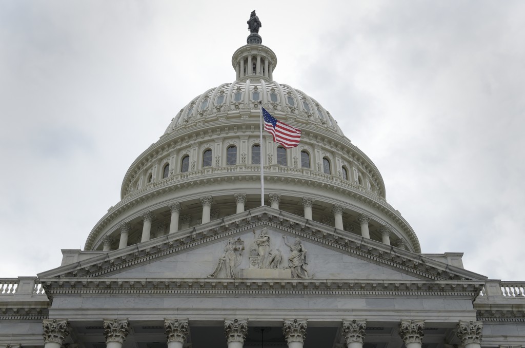 A flag flies in front of the Capitol dome on Capitol Hill in Washington, May 2017.