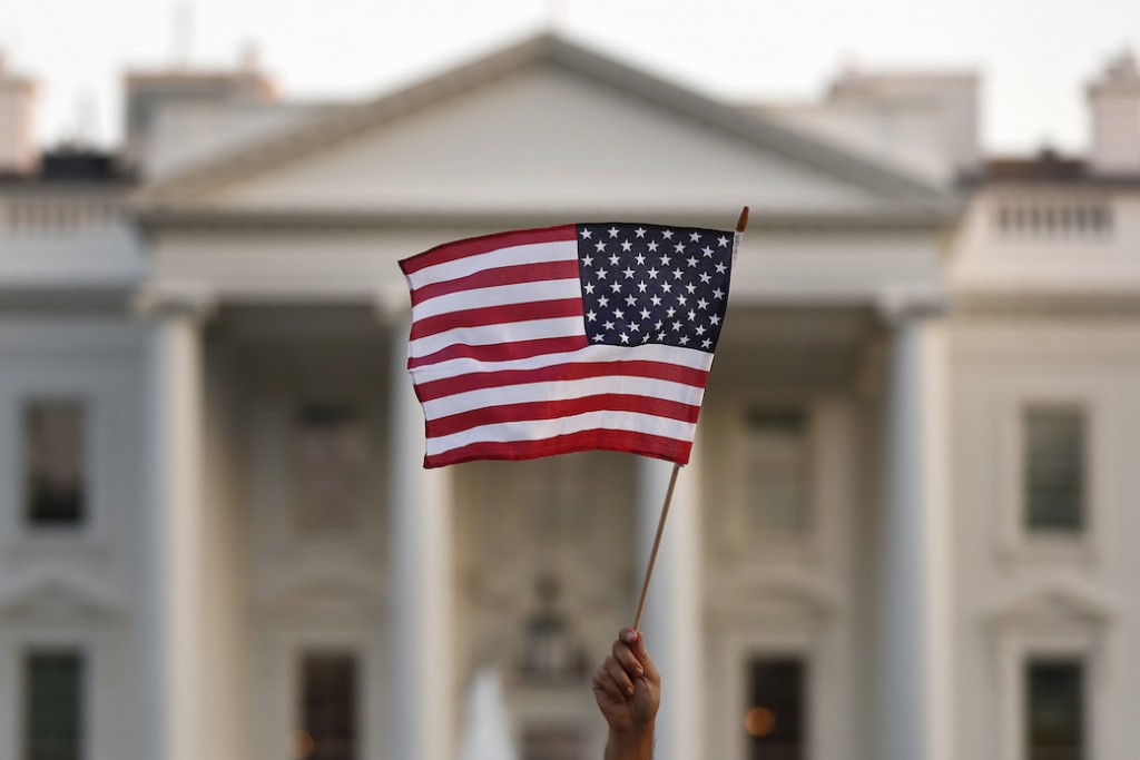A supporter of the Deferred Action for Childhood Arrivals waves a flag during a rally at the White House in September 2017.