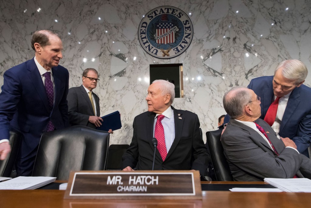 Sen. Orrin Hatch (R-UT) welcomes other senators, Washington, November 13, 2017.