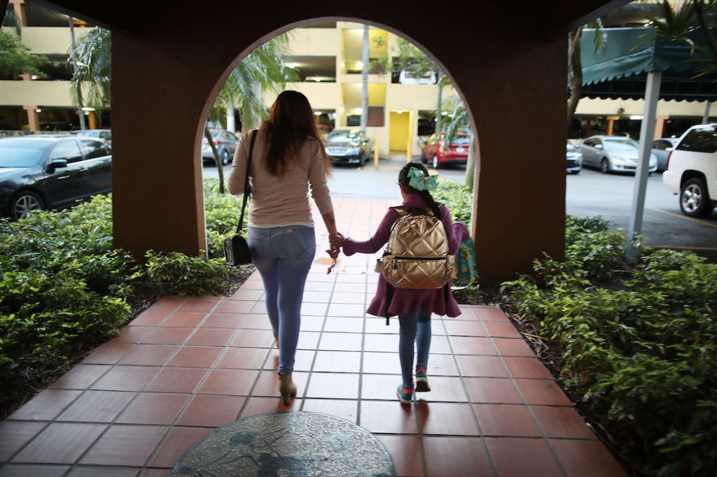 Lorena Jofre, a DACA recipient, walks her daughter to school before driving to work in Miami, Florida, February 2018.