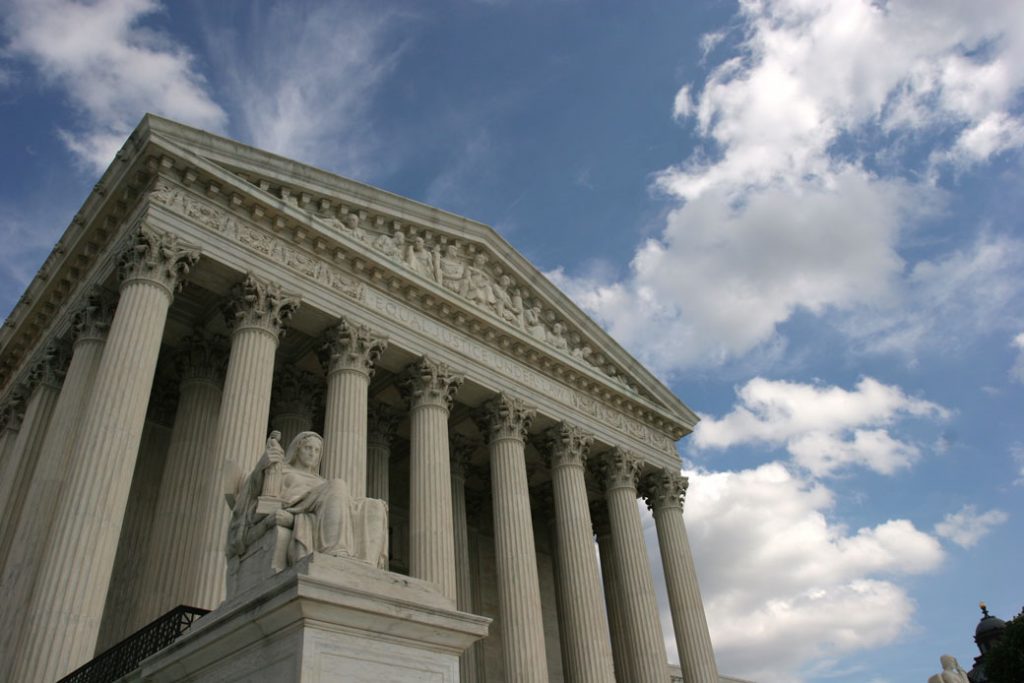 The Contemplation of Justice statue stands in front of the U.S. Supreme Court in Washington, D.C.