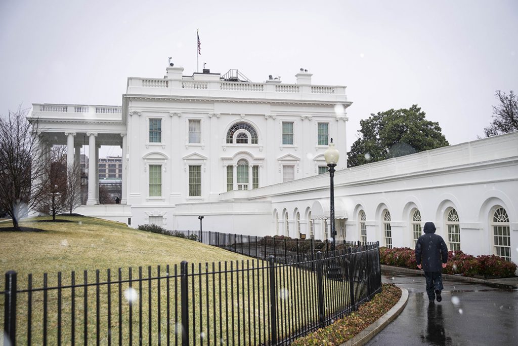 The exterior of the White House is seen during a brief snowstorm on February 7, 2021, in Washington.