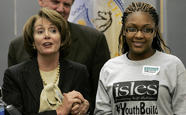 Then-Speaker of the House of Representatives Nancy Pelosi (D-CA) holds the hand of Nikita McFarland, a student at Isles YouthBuild Institute, Friday, February 29, 2008, in Trenton, New Jersey.