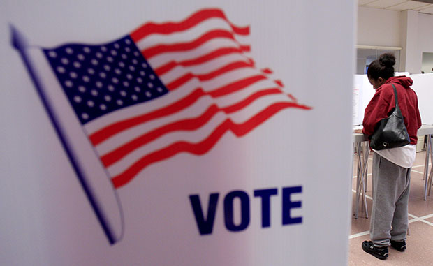 A woman votes at the Cuyahoga County Board of Elections in Cleveland, January 31, 2012, as early voting began in Ohio's March 6 presidential primary.