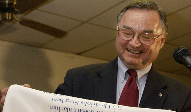 Republican Judge Lloyd A. Karmeier smiles as he reads from a t-shirt, "Top Ten Reasons I Voted For Judge Karmeier," after defeating Democrat Gordon E. Maag for a seat on the Illinois Supreme Court, Tuesday, November 2, 2004, during an election night gathering at the American Legion Hall in Nashville, Illinois.
