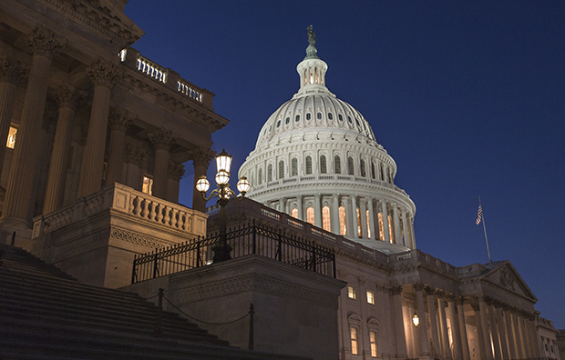 In a rare weekend session at the Capitol, the House of Representatives works into the night to pass a bill to fund the government, Saturday, September 28, 2013.