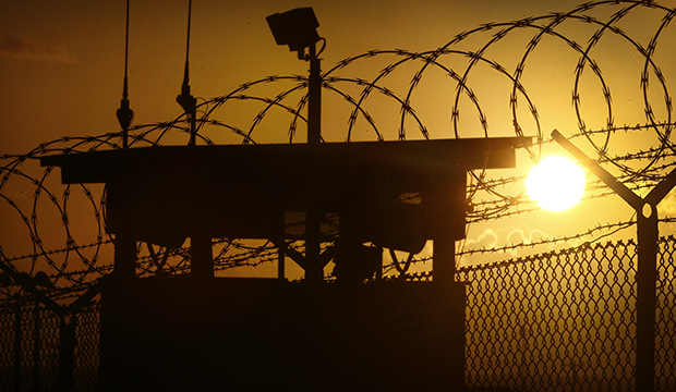 In this photo reviewed by the U.S. military, the sun rises above Camp Delta at Guantanamo Bay Naval Base, Cuba, Wednesday, November 20, 2013.