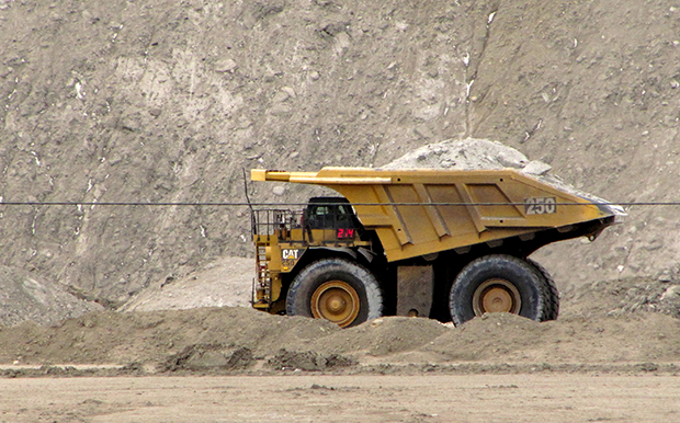 A house-sized dump truck hauls dirt and rock at the Black Thunder coal mine in northeast Wyoming's Powder River Basin near Wright, Wyoming.