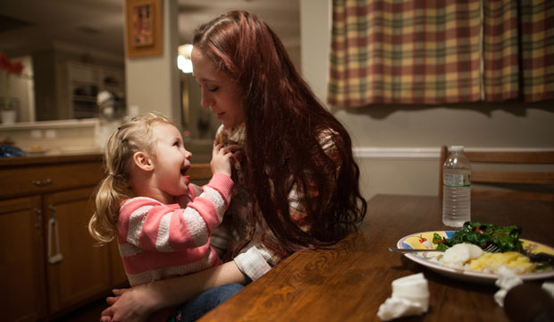 Maggie Barcellano sits with her daughter, Zoe, 3. Barcellano receives food stamps to help feed her daughter.
