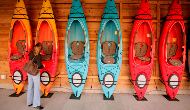 shopper looks at kayaks