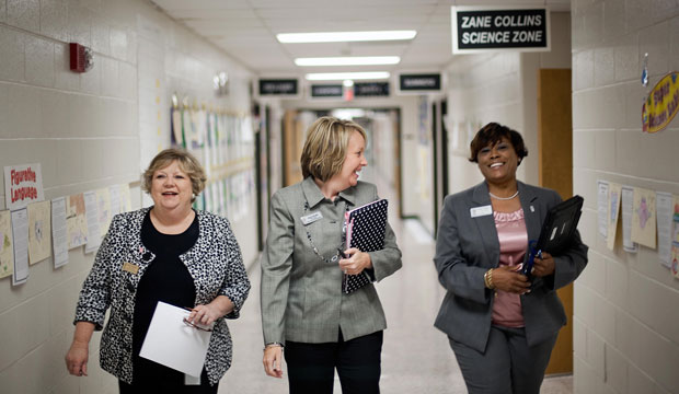 An aspiring principal walks through the halls.