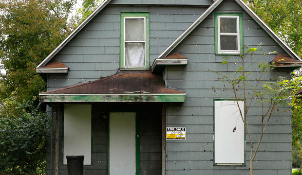 boarded up house