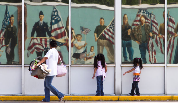 Hispanic family Nebraska flags mural