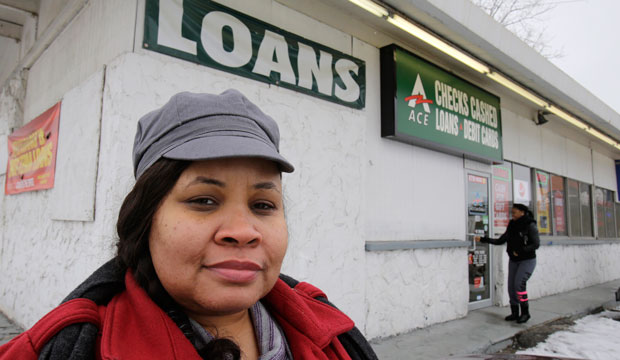 Maranda Brooks stands outside a payday loans business.