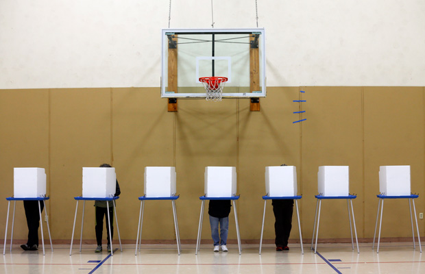 Voters fill out their ballots in a gym on Election Day, November 4, 2014, in Albany, New York.