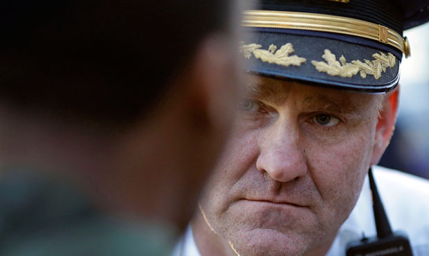 A member of the Baltimore Police Department speaks with a protester during a march for Freddie Gray on April 23, 2015.