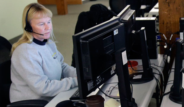 A worker makes calls at a phone bank in St. Paul, Minnesota, on December 31, 2013.