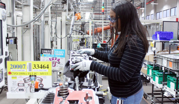Alana Sutton works on an engine at a Harley-Davidson plant in Menomonee Falls, Wisconsin, on November 20, 2014. The company is targeting women to help fill manufacturing jobs.
