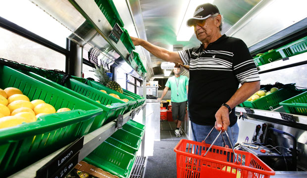 A man shops for fruits and vegetables at a mobile market in Orlando, Florida, on July 15, 2015.
