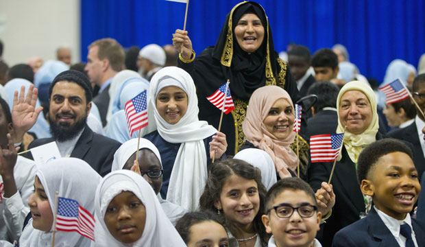 Children from Al-Rahmah school and other guests react after seeing President Barack Obama during his visit to the Islamic Society of Baltimore, February 3, 2016.
